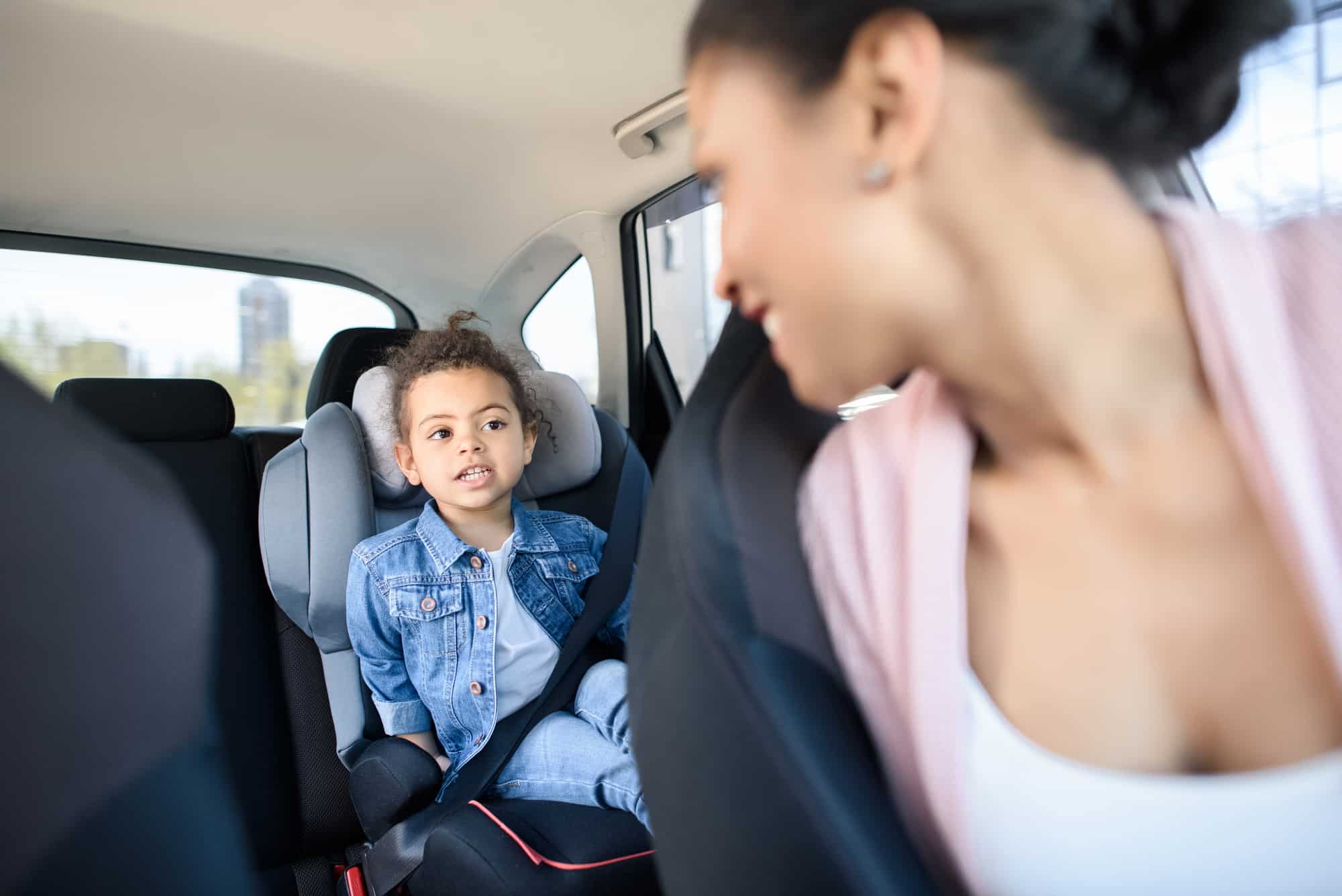 girl and mother in car