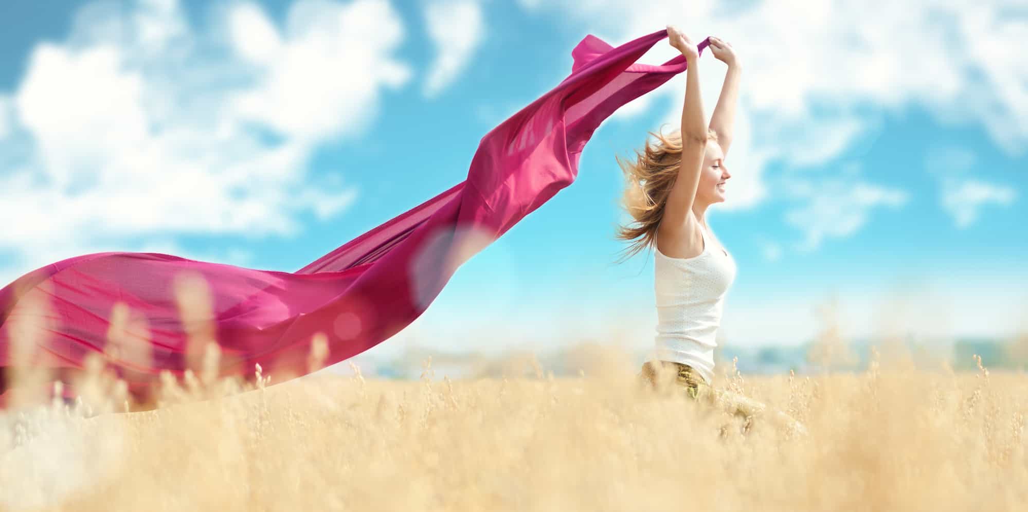 Happy woman on picnic in wheat field