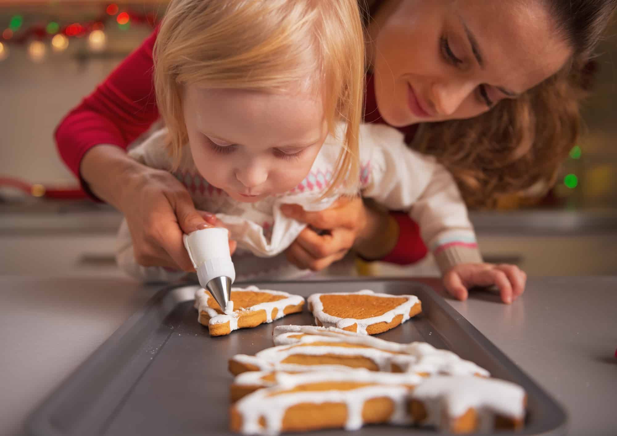 Mom and child baking Christmas cookies