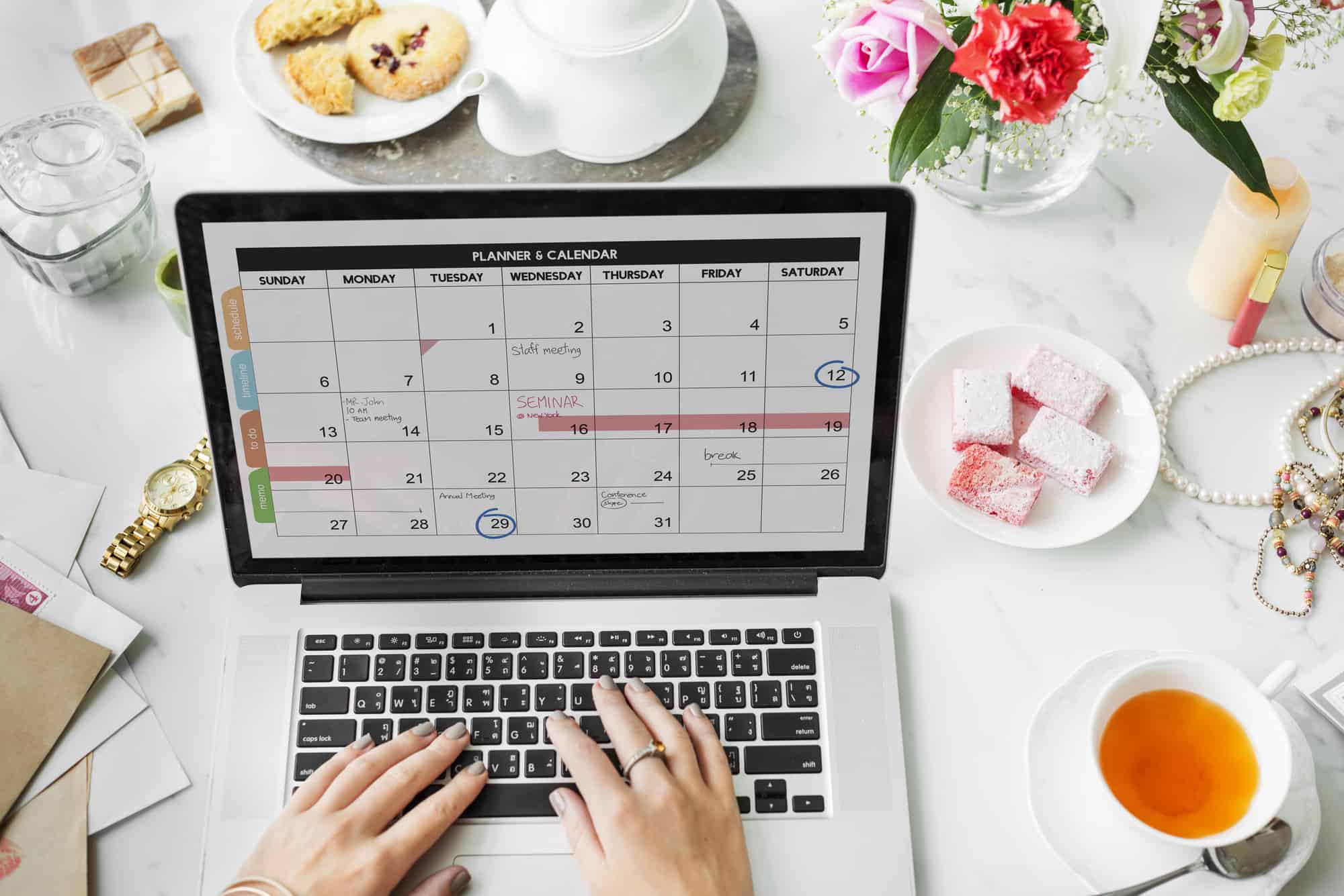 Woman looking at schedule on laptop