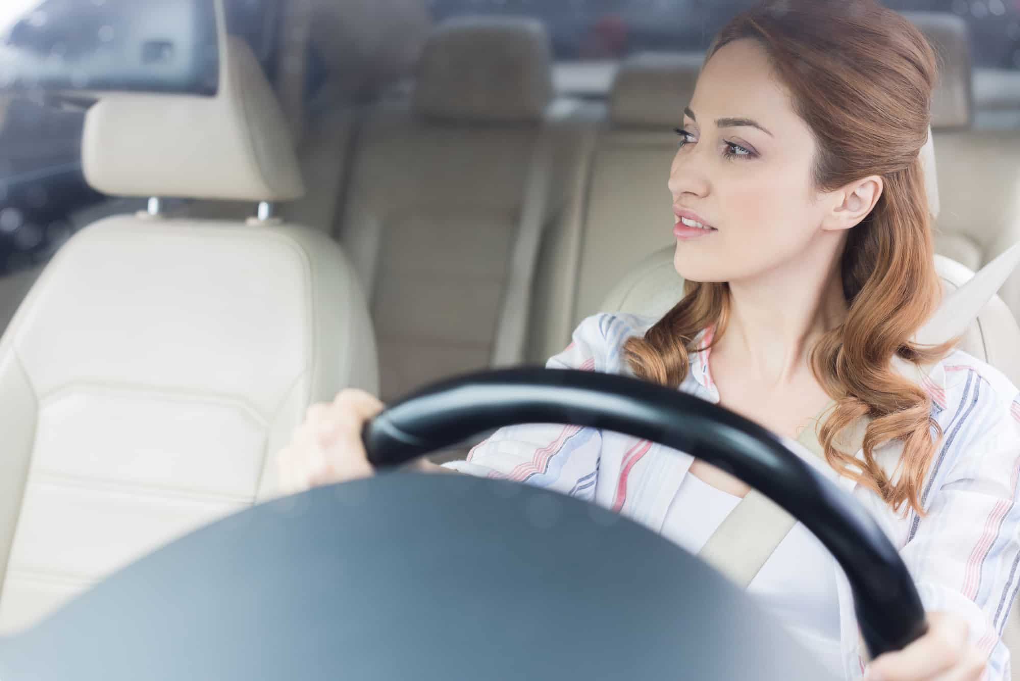 woman driving car alone