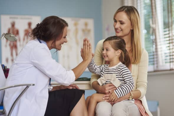 mom and daughter visiting doctor's office